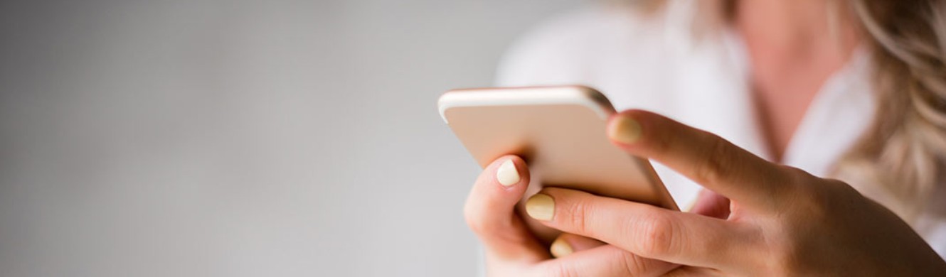 Female hands holding a cellphone 